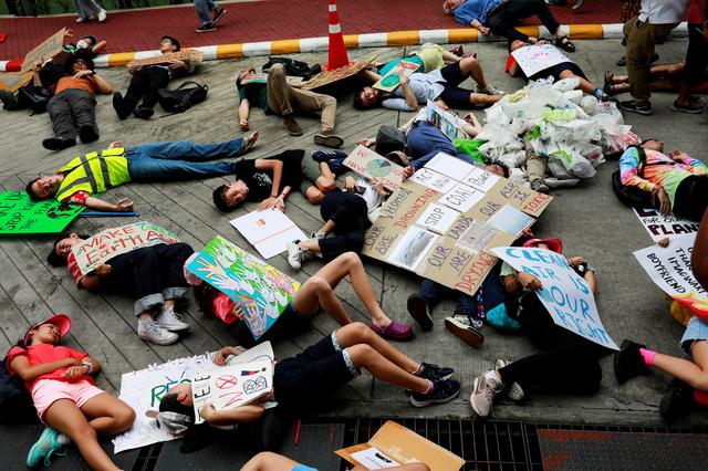 Environmental activist play dead as they participate in a Global Climate Strike near the Ministry of Natural Resources and Environment office in Bangkok, Thailand September 20, 2019. REUTERS/Soe Zeya Tun