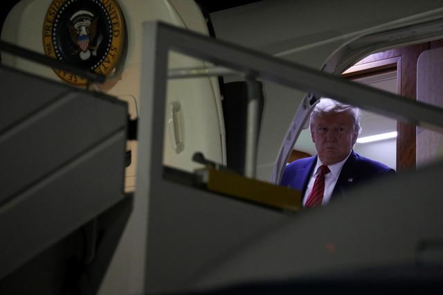 U.S. President Donald Trump exits his cabin to deplane as he arrives aboard Air Force One at John F. Kennedy International Airport in New York, U.S. September 22, 2019. REUTERS/Jonathan Ernst