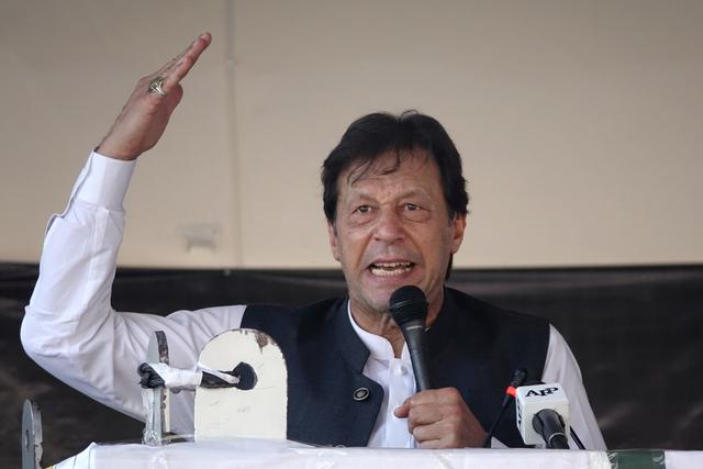 Pakistan's Prime Minister Imran Khan gestures as he speaks during a rally to express solidarity with the people of Kashmir, in Muzaffarabad, Pakistan-administered Kashmir, September 13, 2019. REUTERS/Naseer Chaudary NO RESALES. NO ARCHIVES
