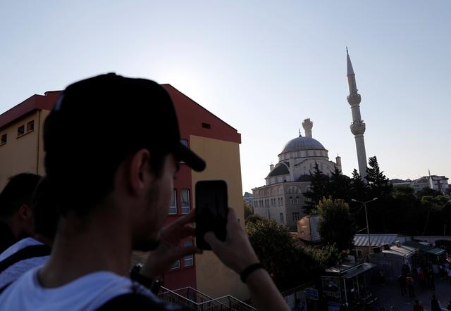 A man takes pictures of a damaged mosque after an earthquake in Istanbul, Turkey, September 26, 2019. REUTERS/Murad Sezer