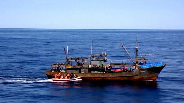 A still image taken from video footage shows a boat with Russian border guards sailing towards a North Korean vessel to detain it and crew members for poaching in waters that Moscow considers its exclusive economic zone, released by Russia's Federal Security Service on September 27, 2019. Federal Security Service/Handout via REUTERS 