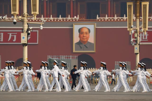 Soldiers march in Tiananmen Square before a wreath laying ceremony marking the 70th anniversary of the founding of the People's Republic of China in Beijing, China, September 30, 2019.   REUTERS/Thomas Peter