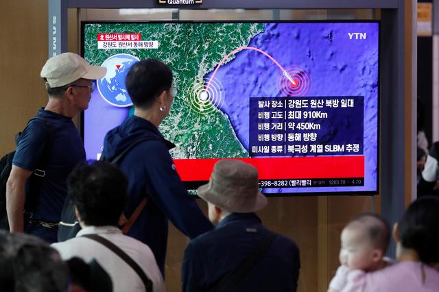 People watch a TV broadcasting a news report on North Korea firing a missile that is believed to be launched from a submarine, in Seoul, South Korea, October 2, 2019. REUTERS/Kim Hong-Ji