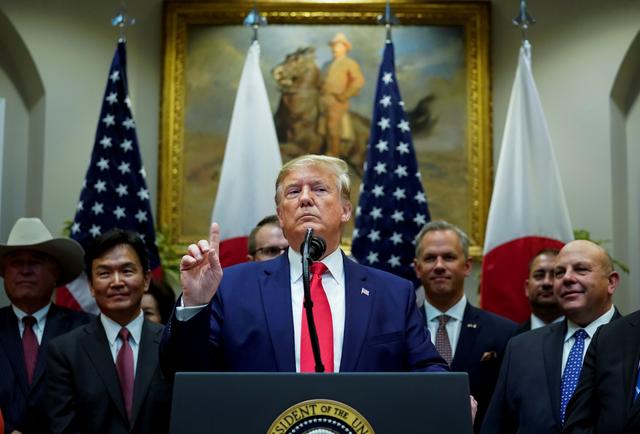 FILE PHOTO: U.S. President Donald Trump speaks about Turkey and Syria during a formal signing ceremony for the U.S.-Japan Trade Agreement at the White House in Washington, October 7, 2019.  REUTERS/Kevin Lamarque/File Photo