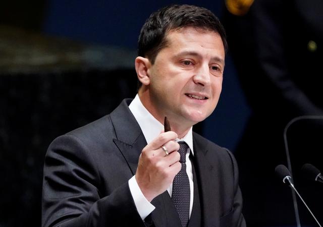 FILE PHOTO: Ukraine's President Volodymyr Zelenskiy holds a bullet as he addresses the 74th session of the United Nations General Assembly at U.N. headquarters in New York City, New York, U.S., September 25, 2019.
