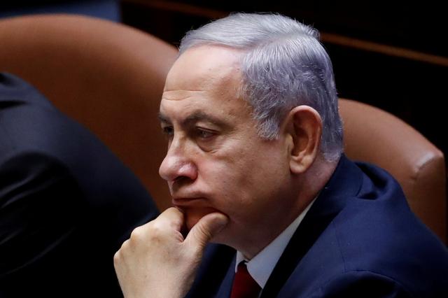 FILE PHOTO: Israeli Prime Minister Benjamin Netanyahu attends the swearing-in ceremony of the 22nd Knesset, the Israeli parliament, in Jerusalem October 3, 2019. REUTERS/Ronen Zvulun/File Photo
