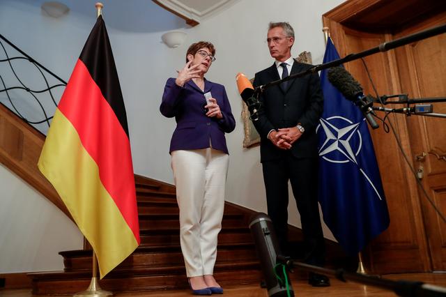FILE PHOTO: NATO Secretary General Jens Stoltenberg meets with German Defence Minister Annegret Kramp-Karrenbauer in Brussels, Belgium July 31, 2019.  Stephanie Lecocq/Pool via REUTERS/File Photo