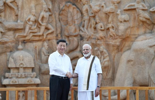 China's President Xi Jinping shakes hand with India's Prime Minister Narendra Modi during their visit to Arjuna's Penance in Mamallapuram on the outskirts of Chennai, India, October 11, 2019. India's Press Information Bureau/Handout via REUTERS  ATTENTION EDITORS - THIS IMAGE WAS PROVIDED BY A THIRD PARTY. NO RESALES. NO ARCHIVES.