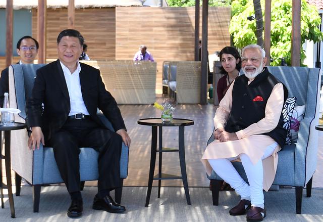 India's Prime Minister Narendra Modi and China's President Xi Jinping look on during their meeting in Mamallapuram on the outskirts of Chennai, India, October 12, 2019. India's Press Information Bureau/Handout via REUTERS 