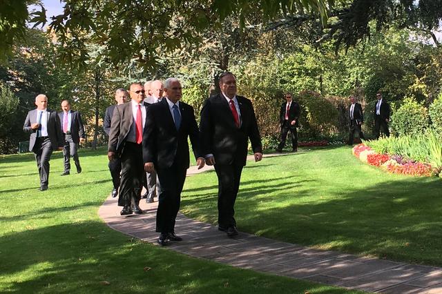 U.S. Vice President Mike Pence and Secretary of State Mike Pompeo walk out of the U.S. ambassador's residence before talks with Turkish President Tayyip Erdogan on reaching a ceasefire in Syria, in Ankara, Turkey October 17, 2019. Shaun Tandon/Pool via REUTERS