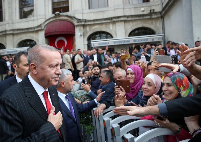 Turkish President Tayyip Erdogan greets people as he leaves from a mosque after the Friday prayers in Istanbul, Turkey, October 18, 2019. Murat Kula/Presidential Press Office/Handout via REUTERS