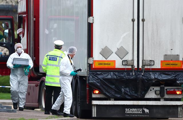 FILE PHOTO: Police are seen at the scene where bodies were discovered in a lorry container, in Grays, Essex, Britain October 23, 2019.  REUTERS/Hannah McKay/File Photo
