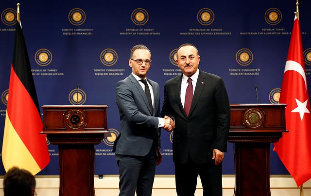 Turkish Foreign Minister Mevlut Cavusoglu and his German counterpart Heiko Maas shake hands, in Ankara, Turkey, October 26, 2019. REUTERS/ Alp Eren Kaya