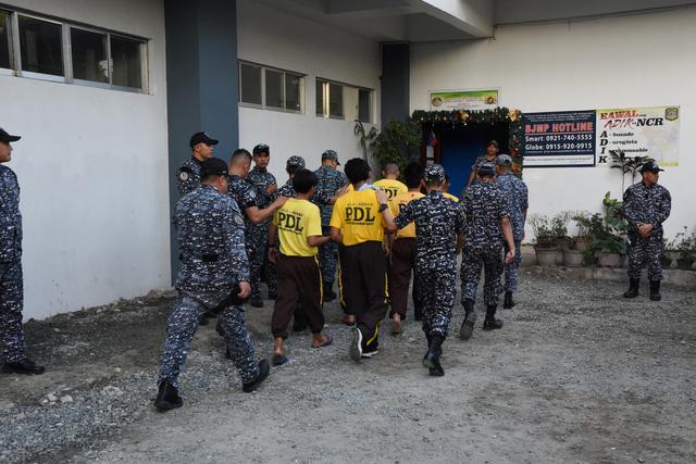 Some of the accused in the 2009 Maguindanao Massacre are escorted to attend the promulgation of the case, inside a prison facility in Taguig City, Philippines, in this December 19, 2019 handout picture. Supreme Court of the Philippines - Public Information Office (SC-PIO) / Handout via REUTERS