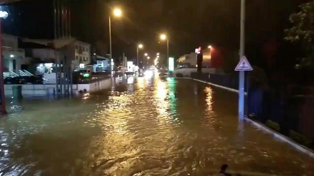 A flooded street is pictured as Storm Elsa sweeps through Trofa, in Porto, Portugal, December 20, 2019, in this still image taken from a social media video./via REUTERS 