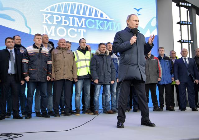 Russian President Vladimir Putin delivers a speech during the opening ceremony of the railway part of a bridge, which was constructed to connect the Russian mainland with the Crimean Peninsula across the Kerch Strait, in Taman, Russia December 23, 2019. Sputnik/Aleksey Nikolskyi/Kremlin via REUTERS 