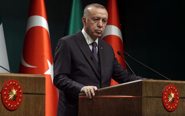 Turkish President Tayyip Erdogan reacts during a news conference in Ankara, Turkey January 13, 2020. REUTERS/Umit Bektas