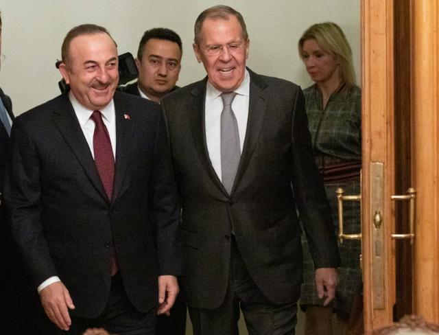 Turkish Foreign Minister Mevlut Cavusoglu and Russian Foreign Minister Sergei Lavrov arrive for a meeting in Moscow, Russia January 13, 2020. Pavel Golovkin/Pool via REUTERS