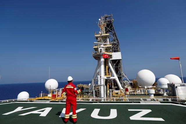 FILE PHOTO: A Turkish Petroleum (TPAO) engineer poses on the helipad of Turkish drilling vessel Yavuz in the eastern Mediterranean Sea off Cyprus, August 6, 2019. REUTERS/Murad Sezer/File Photo
