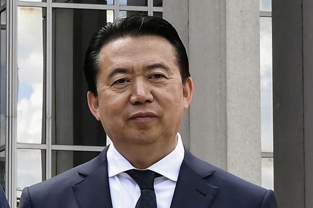 FILE PHOTO: INTERPOL President Meng Hongwei poses during a visit to the headquarters of International Police Organisation in Lyon, France, May 8, 2018. Picture taken May 8, 2018.   Jeff Pachoud/Pool via Reuters