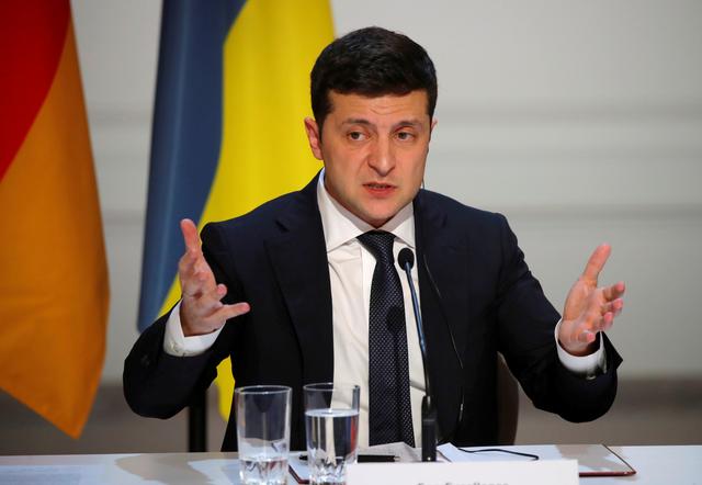 FILE PHOTO: Ukraine's President Volodymyr Zelenskiy speaks during a joint news conference after a Normandy-format summit in Paris, France December 10, 2019. REUTERS/Charles Platiau/Pool