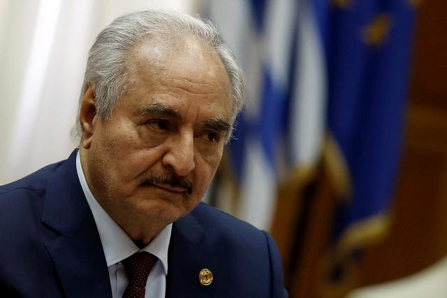 FILE PHOTO: Libyan commander Khalifa Haftar meets Greek Prime Minister Kyriakos Mitsotakis (not pictured) at the Parliament in Athens, Greece, January 17, 2020. REUTERS/Costas Baltas