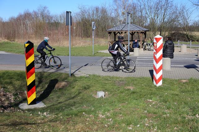 FILE PHOTO: People bike at the local border crossibg between Poland and Germany in Buk - Blankensee, Poland March 14, 2020. Poland will close its borders from March 15, 2020 as a preventive measure against the coronavirus (COVID-19) in Budzisko, Poland March 14, 2020. Cezary Aszkielowicz/Agencja Gazeta via REUTERS 
