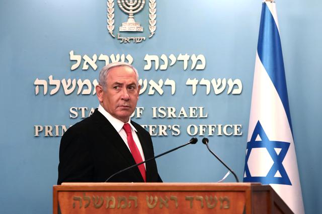 FILE PHOTO: Israeli Prime Minister Benjamin Netanyahu delivers a speech at his Jerusalem office, regarding the new measures that will be taken to fight the coronavirus, March 14, 2020. Gali Tibbon/Pool via REUTERS
