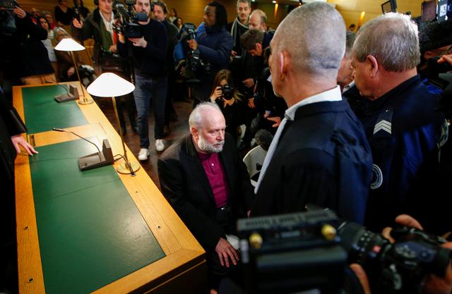 FILE PHOTO: Father Bernard Preynat arrives to attend his trial, on charges of sex abuse of minors, at the courthouse in Lyon, France, January 13, 2020. REUTERS/Emmanuel Foudrot/File Photo