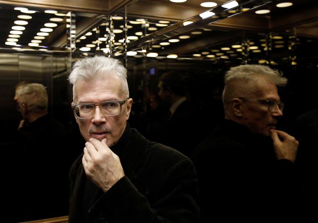 FILE PHOTO: Opposition leader Eduard Limonov leaves the Russian Supreme court in Moscow December 27, 2011. Limonov attended the hearings for his appeal against the Central electoral commission's rejection of his application to be a presidential candidate.   REUTERS/Denis Sinyakov