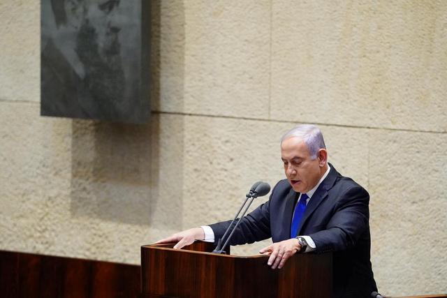 Israeli Prime Minister Benjamin Netanyahu speaks during a swearing in ceremony of his new unity government with election rival Benny Gantz, at the Knesset, Israel's parliament, in Jerusalem May 17, 2020. Adina Valman/Knesset spokespersons' office/Handout via REUTERS 