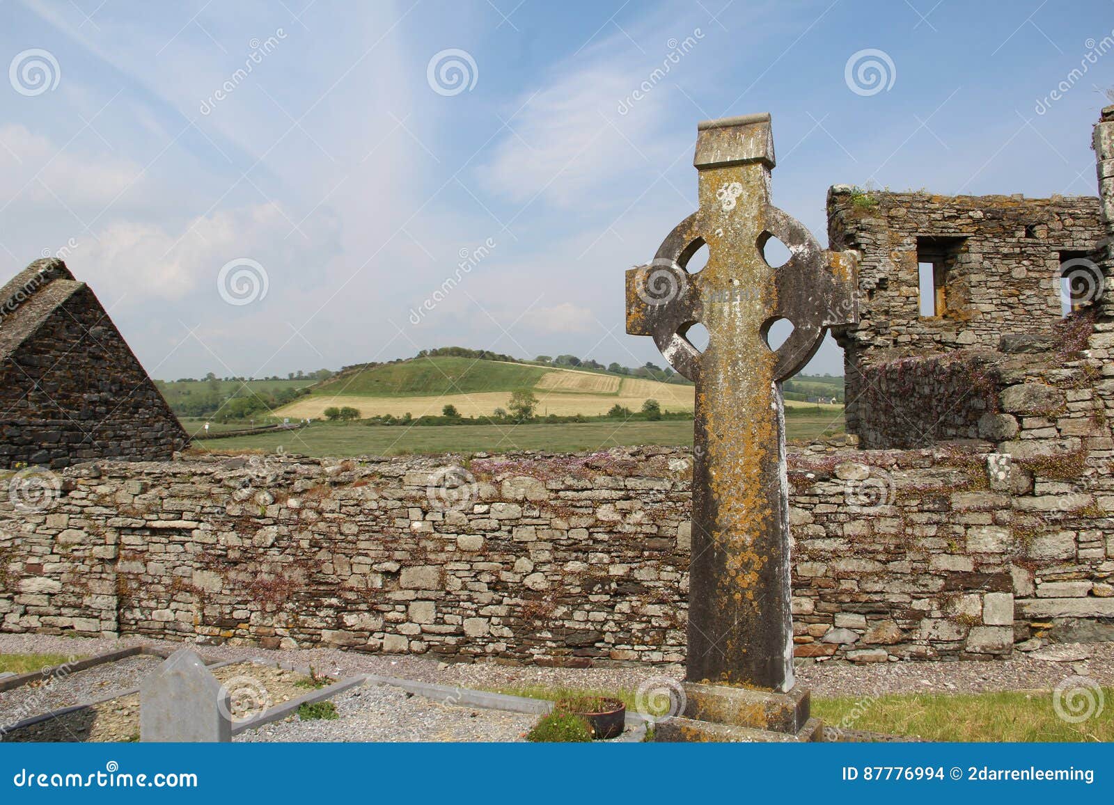 celtic-cross-found-along-wild-atlantic-way-background-green-landscape-ireland-location-west-cork-timoleague-abbey-87776994.jpg