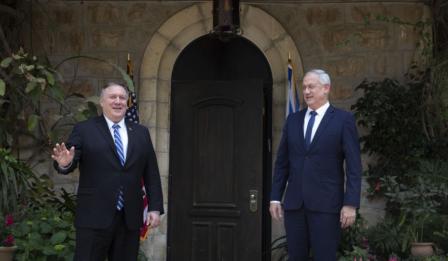 U.S. Secretary of State Mike Pompeo, left, meets Israeli Blue and White party leader Benny Gantz in Jerusalem, Wednesday, May 13, 2020. (AP Photo/Sebastian Scheiner, Pool)